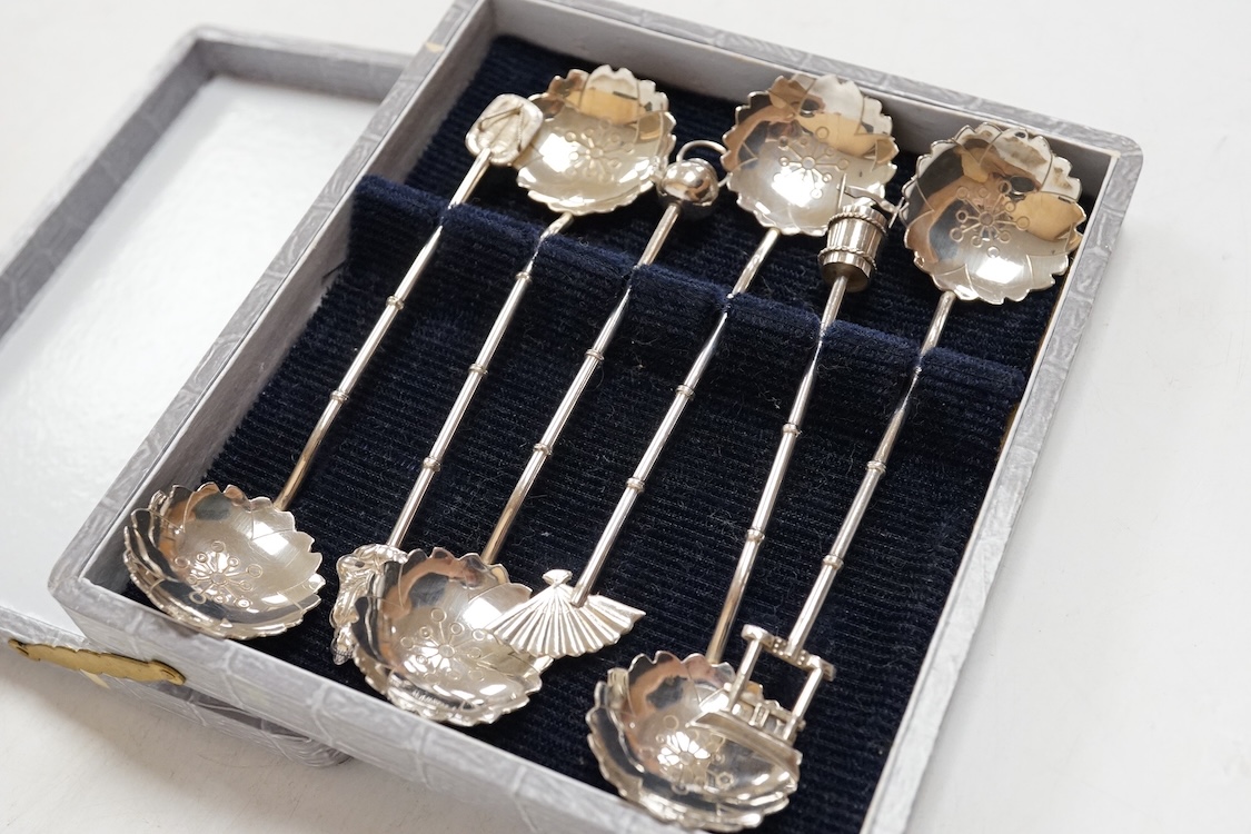 Three assorted silver christening sets including spoon, fork and napkin ring by William Hutton & Sons, London, 1896, one other set with steel knife, two cased sets of silver coffee spoons and a cased set of six Japanese